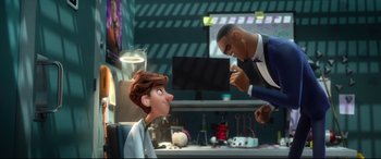 Movie still from “Spies in Disguise” (2019), directed by Troy Quane – An animated scene of a man and a boy; Medium shot, Over the shoulder angle