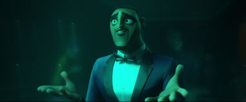 Movie still from “Spies in Disguise” (2019), directed by Troy Quane – A man in a suit and bow tie is looking up; Close Up shot, Low angle