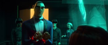 Movie still from “Spies in Disguise” (2019), directed by Troy Quane – A group of people standing next to each other in a room; Medium shot, Over the shoulder angle