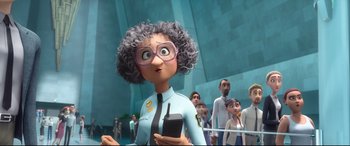 Movie still from “Spies in Disguise” (2019), directed by Troy Quane – An animated woman with a cell phone in her hand; Medium shot, Over the shoulder angle