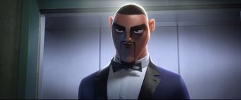 Movie still from “Spies in Disguise” (2019), directed by Troy Quane – An animated man in a suit and tie; Close Up shot, Low angle