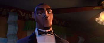 Movie still from “Spies in Disguise” (2019), directed by Troy Quane – A man in a suit and bow tie; Close Up shot, Low angle