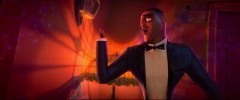 Movie still from “Spies in Disguise” (2019), directed by Troy Quane – A man in a tuxedo is standing in front of a clock; Medium shot, Low angle