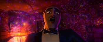 Movie still from “Spies in Disguise” (2019), directed by Troy Quane – A man in a suit and bow tie is looking surprised; Close Up shot, Low angle