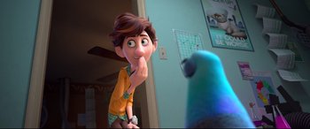 Movie still from “Spies in Disguise” (2019), directed by Troy Quane – A boy and a blue bird in a room with blue walls; Close Up shot, Over the shoulder angle