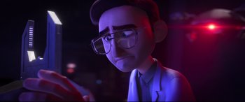 Movie still from “Spies in Disguise” (2019), directed by Troy Quane – A man with glasses and a hat is looking at a cell phone; Close Up shot, Over the shoulder angle