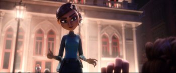 Movie still from “Spies in Disguise” (2019), directed by Troy Quane – A woman is standing in front of a building; Medium shot, Over the shoulder angle