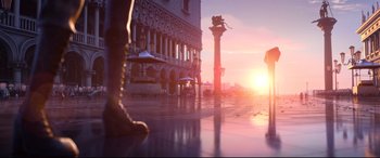 Movie still from “Spies in Disguise” (2019), directed by Troy Quane – The sun is setting over a building with a statue in front of it; Extreme Wide shot, Low angle