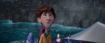 Movie still from “Spies in Disguise” (2019), directed by Troy Quane – A boy with a backpack is standing in front of a waterfall; Close Up shot, Over the shoulder angle