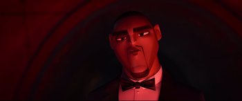 Movie still from “Spies in Disguise” (2019), directed by Troy Quane – An animated man in a suit and bow tie; Close Up shot, Low angle