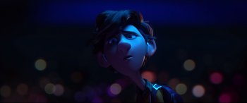 Movie still from “Spies in Disguise” (2019), directed by Troy Quane – A character's face in a dark room; Close Up shot, Over the shoulder angle