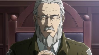 Movie still from “Attack on Titan” (2013), directed by Masashi Koizuka – An old man with a gray beard is looking at the camera; Close Up shot, Low angle