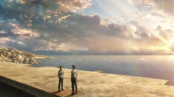 Movie still from “Attack on Titan” (2013), directed by Masashi Koizuka – Two men standing on a beach looking out at the ocean; Extreme Wide shot, Low angle