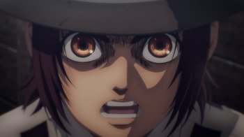 Movie still from “Attack on Titan” (2013), directed by Masashi Koizuka – An animated face of a person with a hat; Extreme Close Up shot, Overhead angle