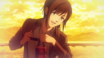 Movie still from “Attack on Titan” (2013), directed by Masashi Koizuka – A woman holding onto a bag while standing on a sidewalk; Medium shot, Over the shoulder angle