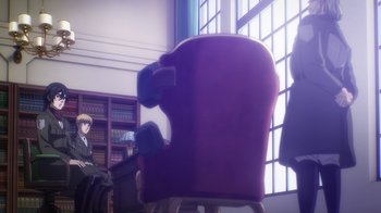Movie still from “Attack on Titan” (2013), directed by Masashi Koizuka – A person sitting in a chair in front of a book case; Wide shot, Over the shoulder angle