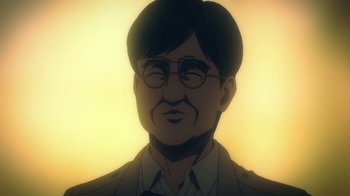 Movie still from “Attack on Titan” (2013), directed by Masashi Koizuka – An illustration of a man wearing glasses and a suit; Close Up shot, Low angle