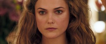 A woman's face with green eyes