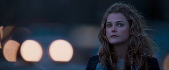 Movie still from “August Rush” (2007), directed by Kirsten Sheridan – A beautiful young woman standing in front of a sunset; Close Up shot, Over the shoulder angle