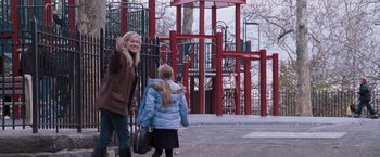 Movie still from “August Rush” (2007), directed by Kirsten Sheridan – A woman and a child walking on a sidewalk; Wide shot, Over the shoulder angle