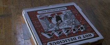 Movie still from “August Rush” (2007), directed by Kirsten Sheridan – View of a pizza box with a picture on it; Extreme Close Up shot, High angle