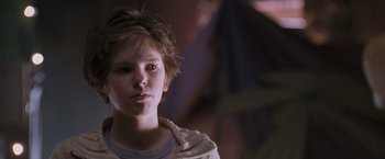 Movie still from “August Rush” (2007), directed by Kirsten Sheridan – A young boy is looking into the camera; Close Up shot, Low angle