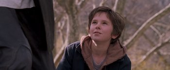Movie still from “August Rush” (2007), directed by Kirsten Sheridan – A young boy is looking up at the sky; Close Up shot, Low angle