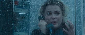 Movie still from “August Rush” (2007), directed by Kirsten Sheridan – A woman talking on a phone in the rain; Close Up shot, Overhead angle