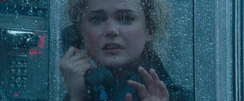 Movie still from “August Rush” (2007), directed by Kirsten Sheridan – A woman is looking out of a window through a rain covered window; Close Up shot, Overhead angle