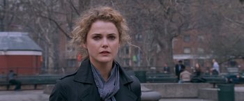 Movie still from “August Rush” (2007), directed by Kirsten Sheridan – A woman in a black jacket and a scarf; Close Up shot, Over the shoulder angle
