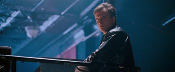 Movie still from “August Rush” (2007), directed by Kirsten Sheridan – A man in a leather jacket leaning on a railing; Close Up shot, Low angle