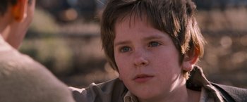 Movie still from “August Rush” (2007), directed by Kirsten Sheridan – A young boy's face; Close Up shot, Low angle