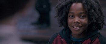 Movie still from “August Rush” (2007), directed by Kirsten Sheridan – A person wearing headphones; Close Up shot, Over the shoulder angle