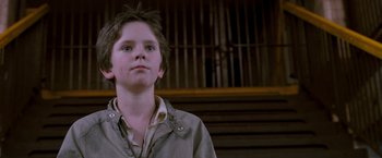 Movie still from “August Rush” (2007), directed by Kirsten Sheridan – A young boy is looking up at the sky; Close Up shot, Low angle
