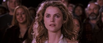 Movie still from “August Rush” (2007), directed by Kirsten Sheridan – Keri russell's face in a crowd; Close Up shot, Over the shoulder angle