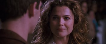 Movie still from “August Rush” (2007), directed by Kirsten Sheridan – A person with long hair; Close Up shot, Over the shoulder angle