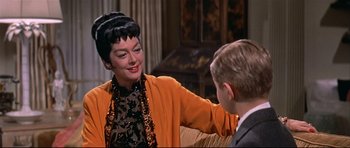 Movie still from “Auntie Mame” (1958), directed by Morton DaCosta – An older woman and a young boy in a living room; Close Up shot, Over the shoulder angle