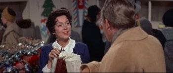 Movie still from “Auntie Mame” (1958), directed by Morton DaCosta – An older man and a young woman are talking to each other; Medium shot, Over the shoulder angle