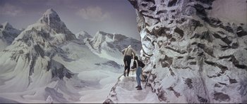 Movie still from “Auntie Mame” (1958), directed by Morton DaCosta – Two people are walking up a snowy mountain; Extreme Wide shot, High angle