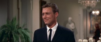 Movie still from “Auntie Mame” (1958), directed by Morton DaCosta – A person wearing a suit and tie; Close Up shot, Low angle