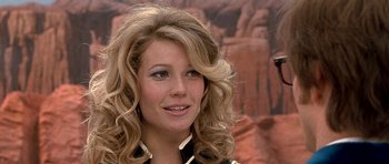 Movie still from “Austin Powers in Goldmember” (2002), directed by Jay Roach – A person with long blonde hair; Close Up shot, Low angle
