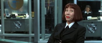Movie still from “Austin Powers in Goldmember” (2002), directed by Jay Roach – A woman dressed in a suit and red hair; Close Up shot, Low angle