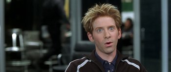 Movie still from “Austin Powers in Goldmember” (2002), directed by Jay Roach – A person wearing a jacket and looking surprised; Close Up shot, High angle