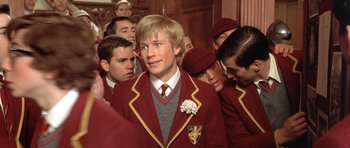Movie still from “Austin Powers in Goldmember” (2002), directed by Jay Roach – A group of young men standing next to each other; Close Up shot, Low angle