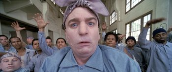 Movie still from “Austin Powers in Goldmember” (2002), directed by Jay Roach – A person with a tie on his head; Close Up shot, Low angle