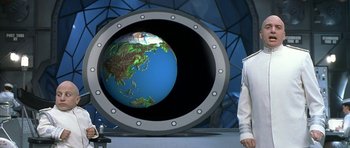 Movie still from “Austin Powers in Goldmember” (2002), directed by Jay Roach – A man standing in front of a globe in a porthole; Medium shot, High angle