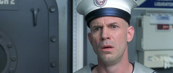 Movie still from “Austin Powers in Goldmember” (2002), directed by Jay Roach – A person wearing a hat; Close Up shot, Low angle