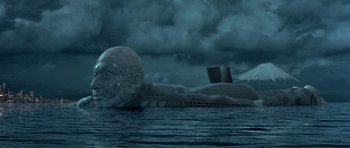 Movie still from “Austin Powers in Goldmember” (2002), directed by Jay Roach – An image of a giant head floating in the water; Extreme Wide shot, High angle