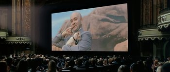 Movie still from “Austin Powers in Goldmember” (2002), directed by Jay Roach – A man and a cat in front of a screen; Wide shot, Low angle