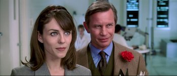 Movie still from “Austin Powers: International Man of Mystery” (1997), directed by Jay Roach – A man and a woman standing next to each other; Close Up shot, Over the shoulder angle